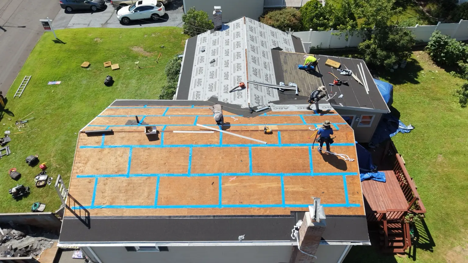 Decking seams taped as protective roof layers are installed.