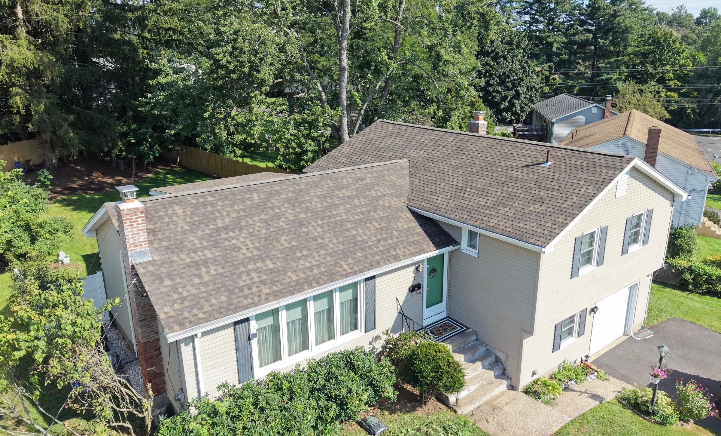 An EverGuard roof replacement on a Connecticut home, surrounded by trees